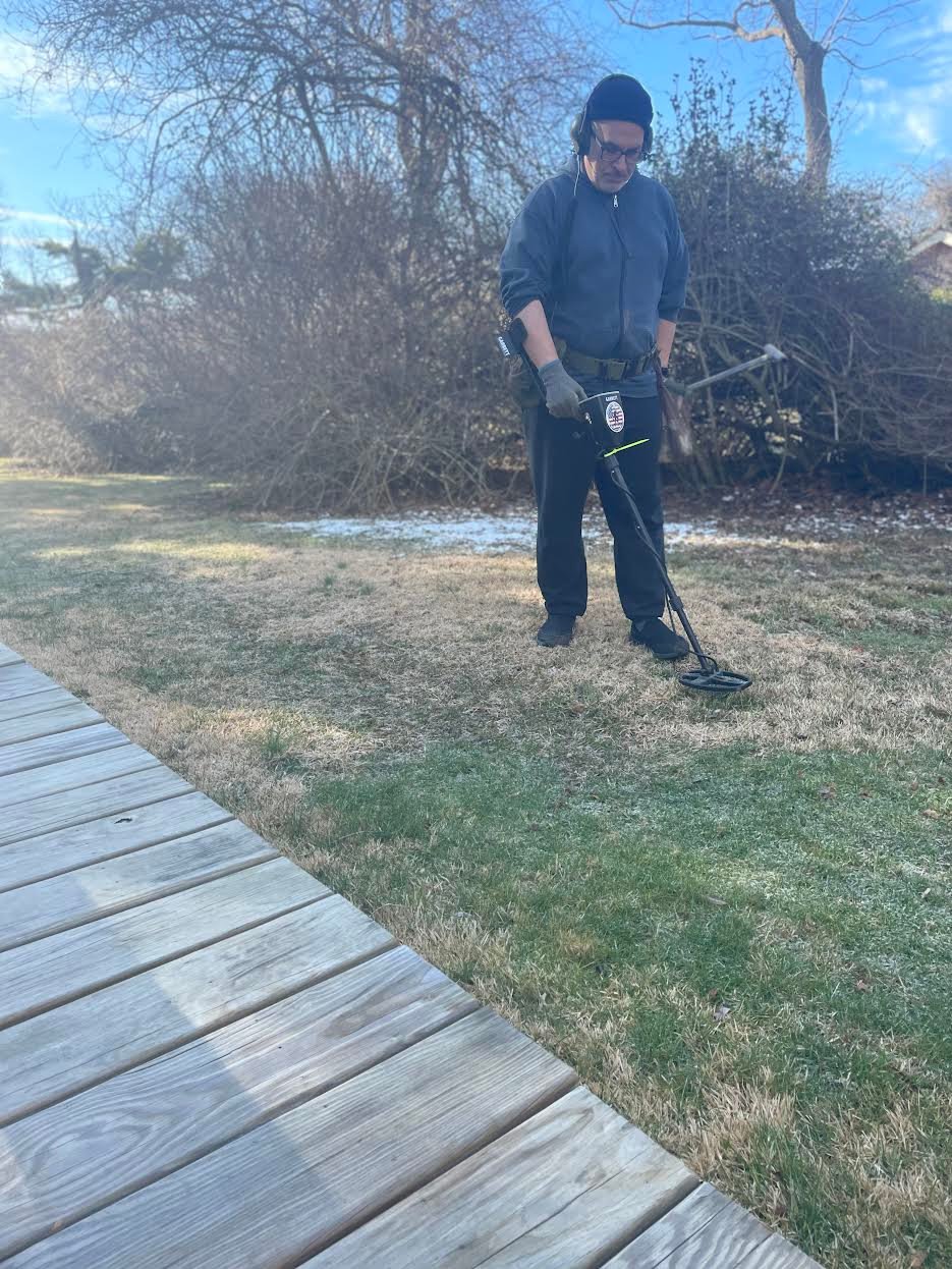 Bellport resident Mike Pisano, retired private chef, 
enjoys going out a few times a week to metal detect private properties in search of historic finds that he will then
restore and research.